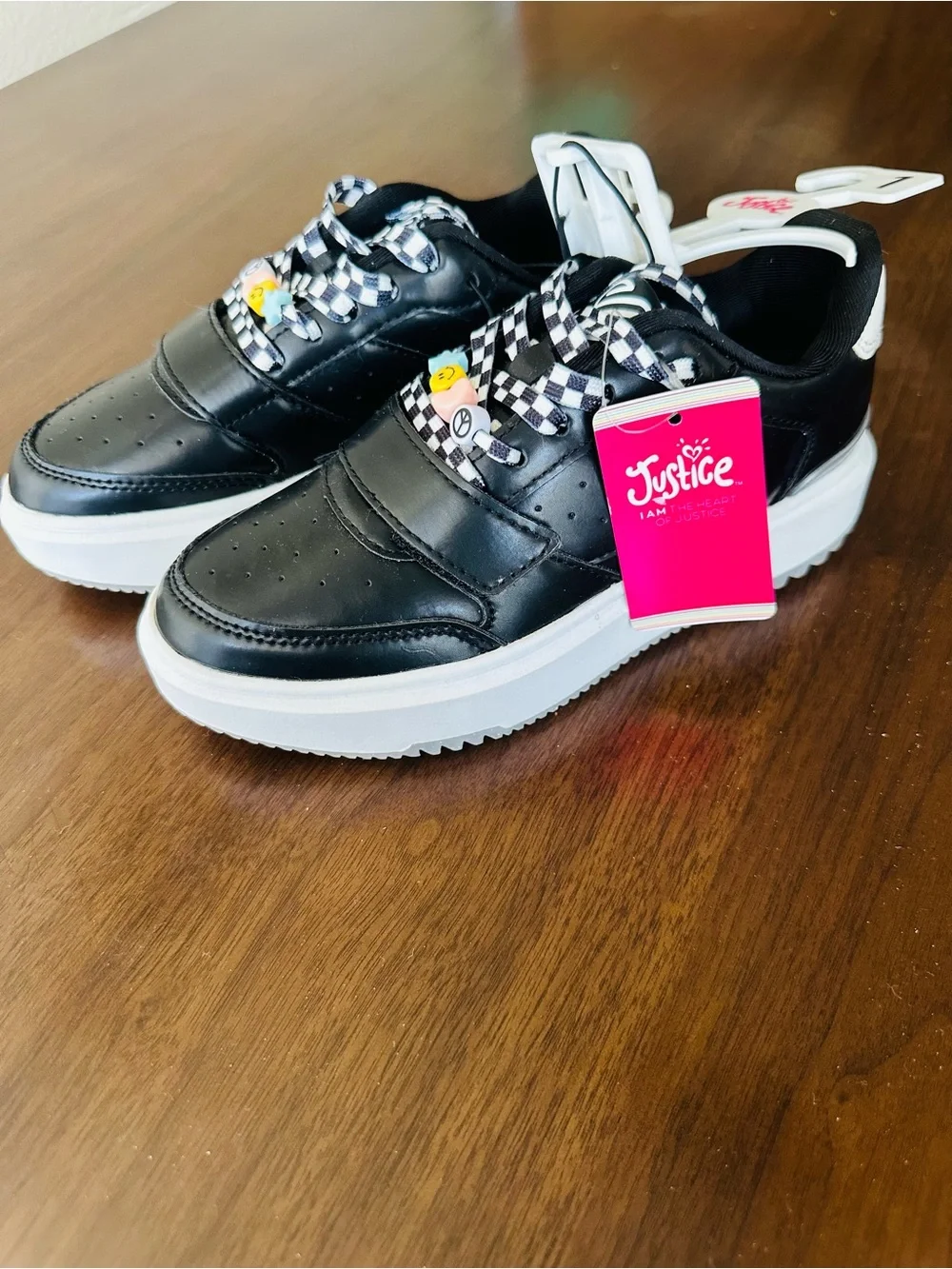 Justice Black Platform Sneakers with Checkerboard Laces and Colorful Charm